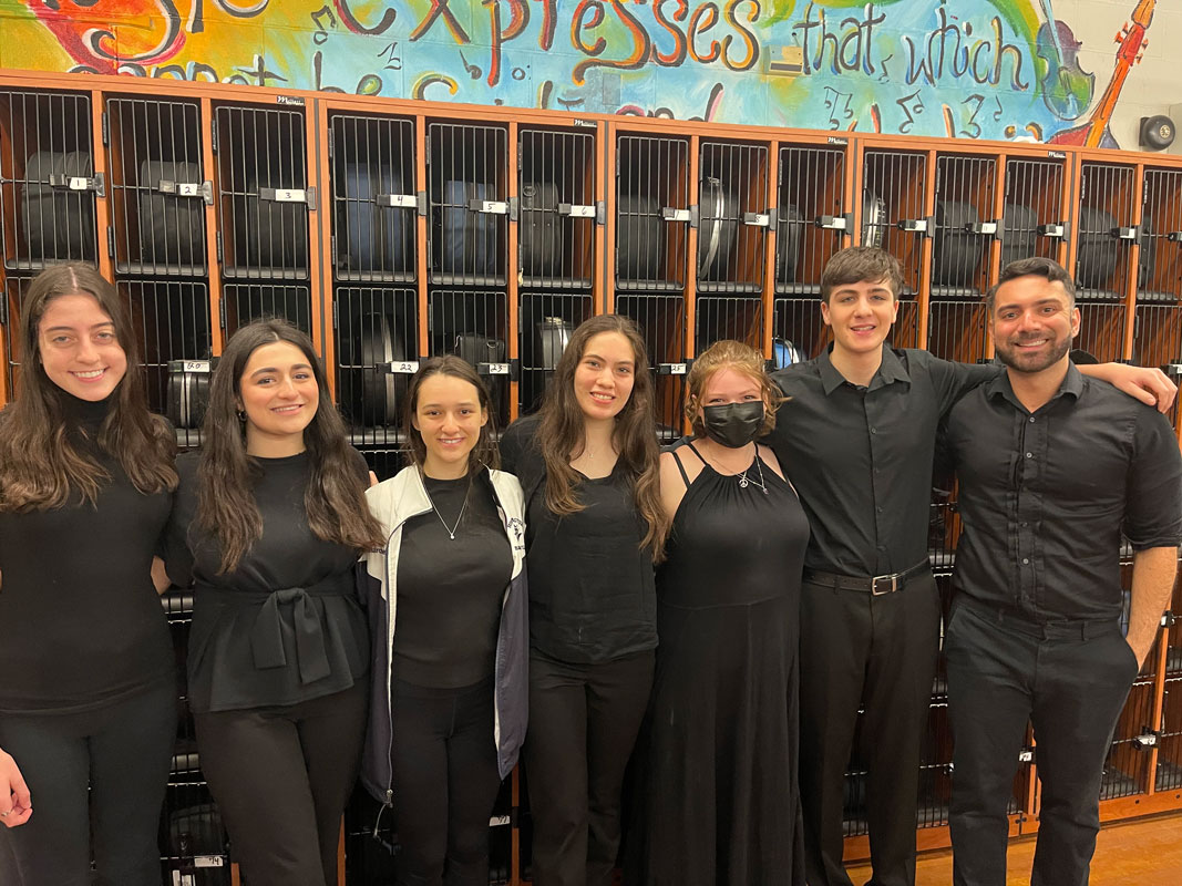 A group of Huntington chamber orchestra members with director James DiMeglio.