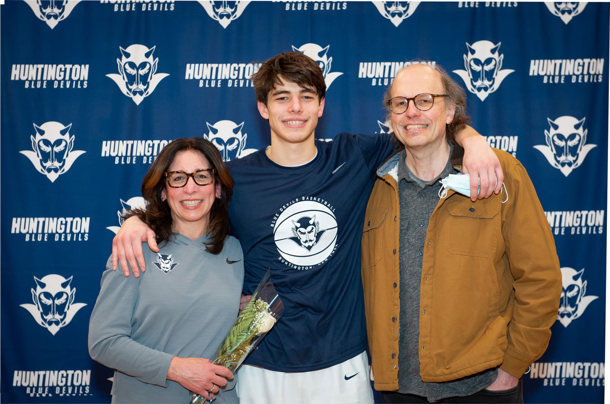 Max Rentsch is flanked by his parents, Helen and Andreas on Senior Day. (Darin Reed photo.)