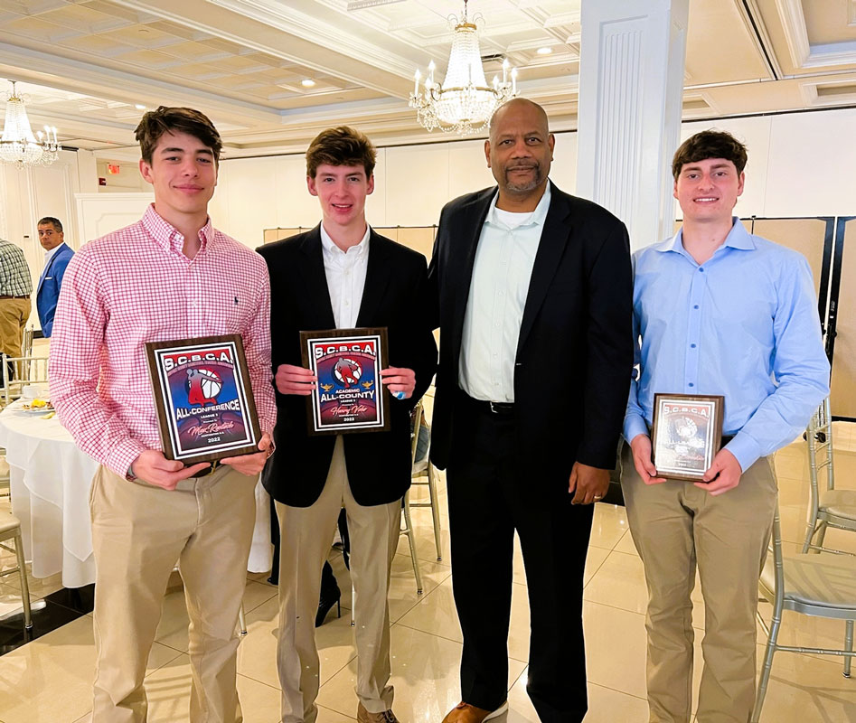Coach Ken Parham with Max Rentsch, Henry Vohs and Hunter Borenstei