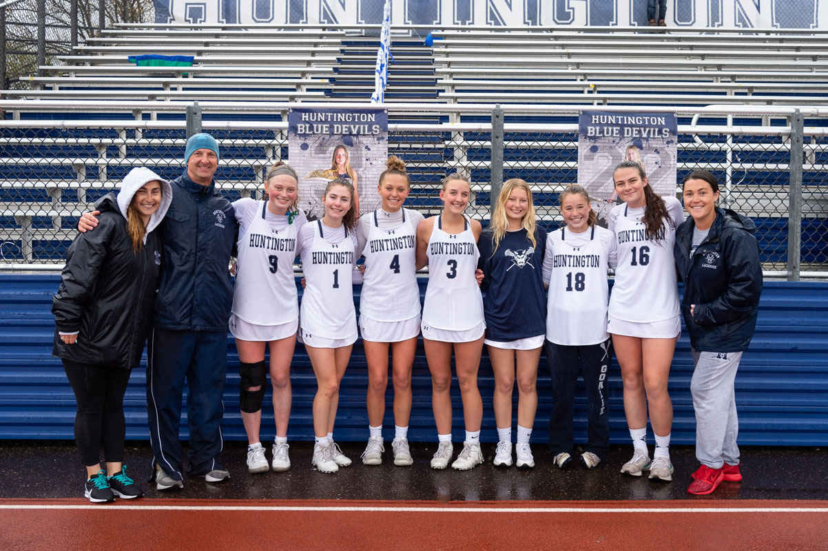 Blue Devil girls' lacrosse seniors with coaches Katie Reilly, Chris Taylor and Shea Scully. (Darin Reed photo.)