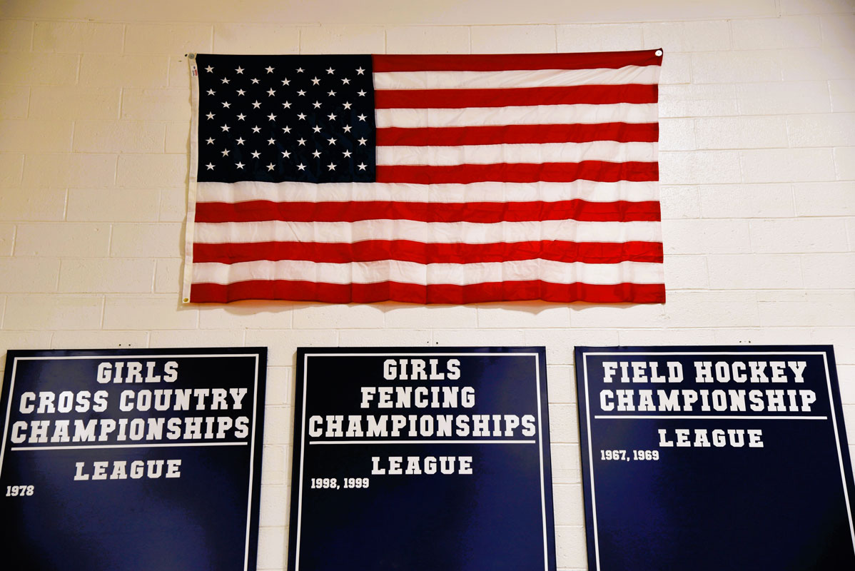 A large American flag in affixed to the wall on the main court with additional flags on side walls.
