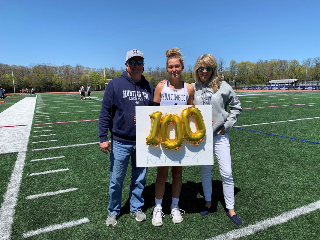 Katie Browne is flanked by her parents, Doug and Karen.
