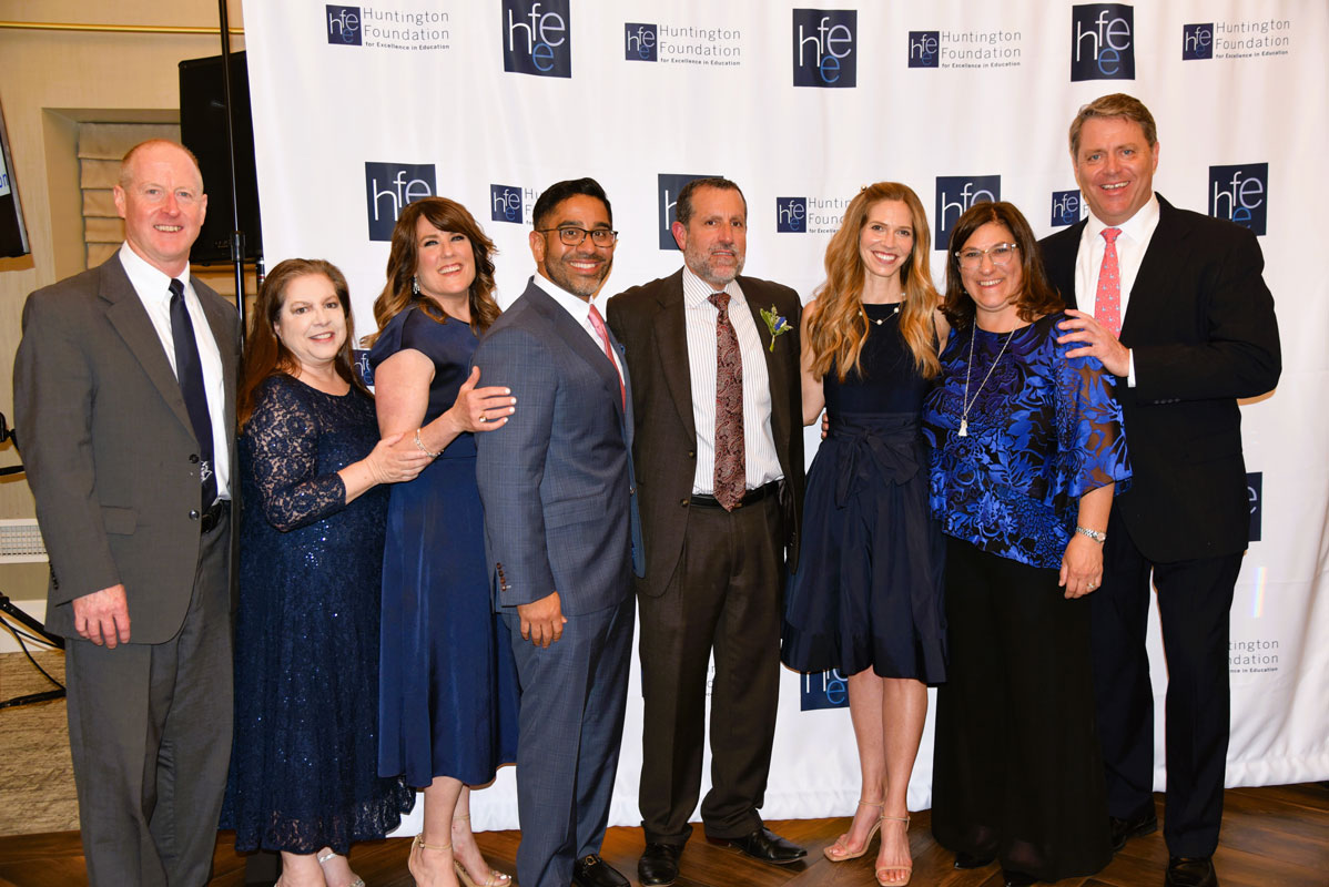 Huntington School Board members flank honoree James W. Polansky 