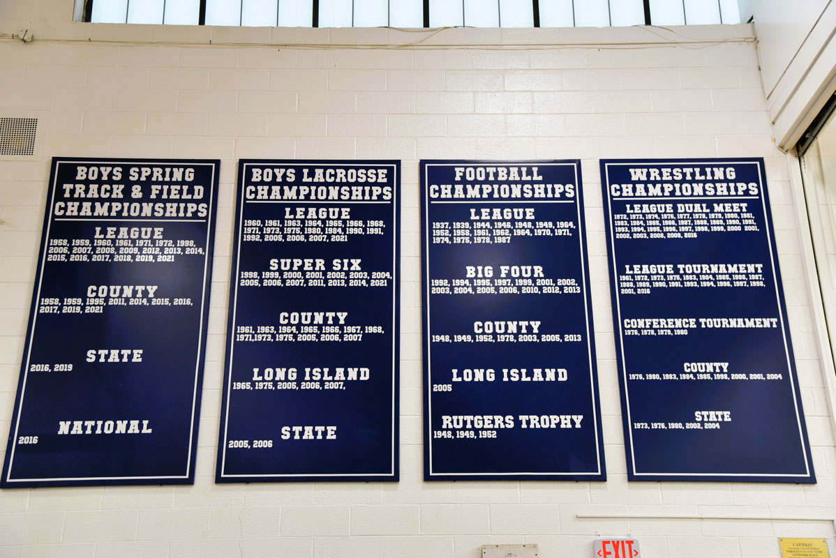 Every sports program's championships are listed on separate team banners.