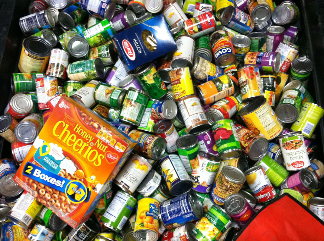 Huntington High School student government members ride a bus full of food for the hungry.