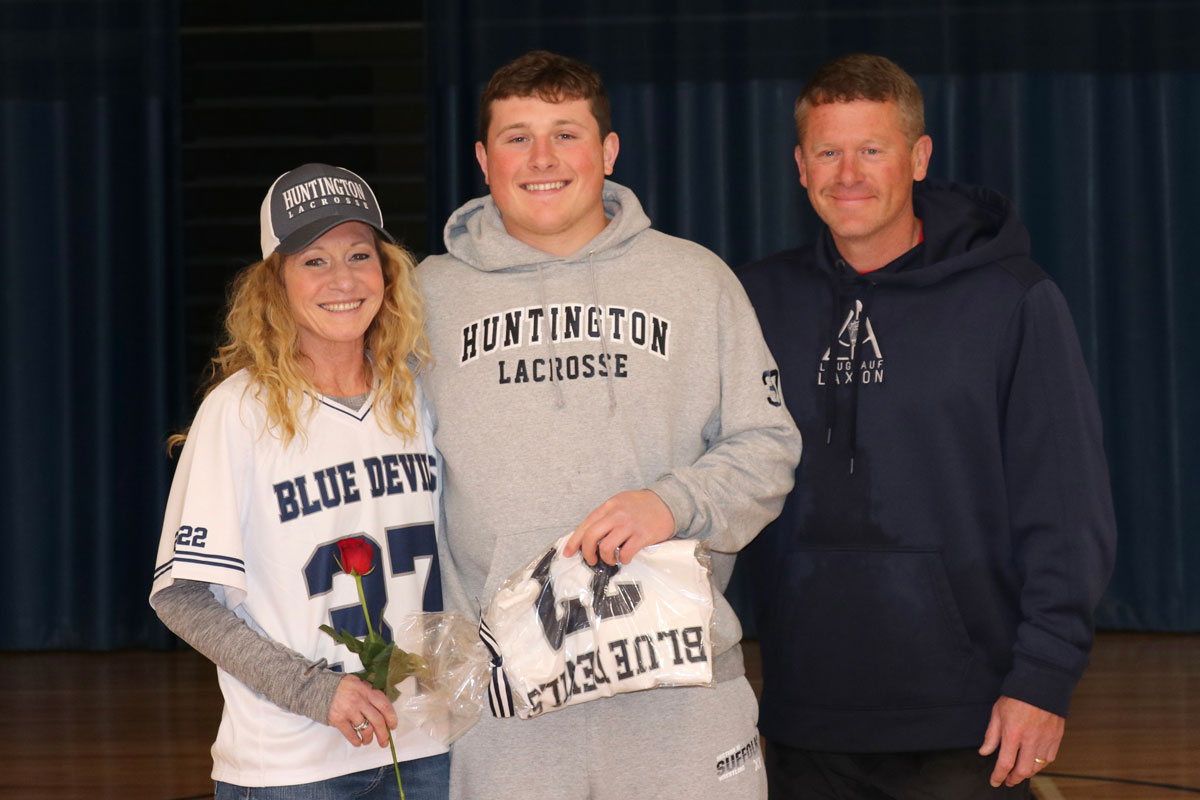 Senior Robbie Smith with his parents, Allison and Travis.