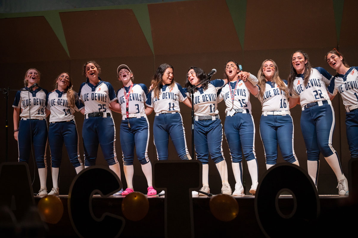 The fully uniformed Blue Devil softball team covered Bruno Mars' When I Was Your Man. (Darin Reed photo.)