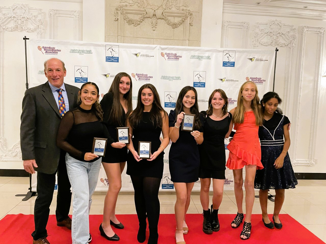 Head coach Jamie Fishlow with the team's seven post-season award honorees.