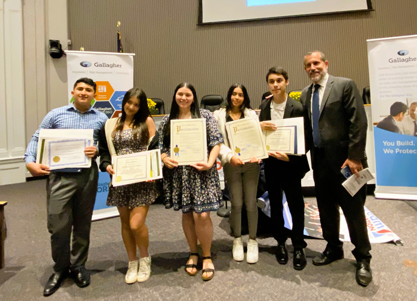Huntington Superintendent James Polansky with five award recipients.