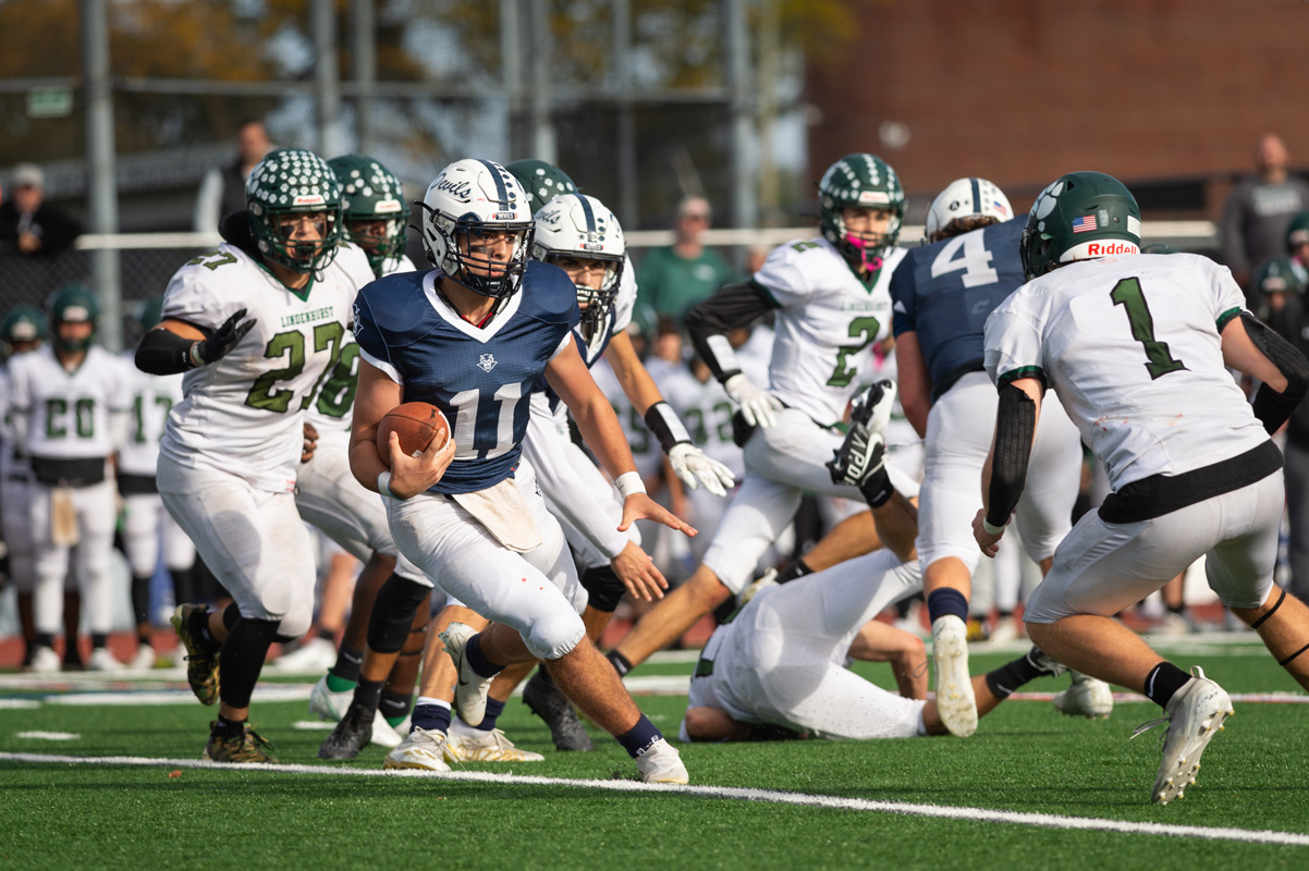 Quarterback Anthony Annunziata puts the moves on the defense last fall. (Darin Reed photo.)