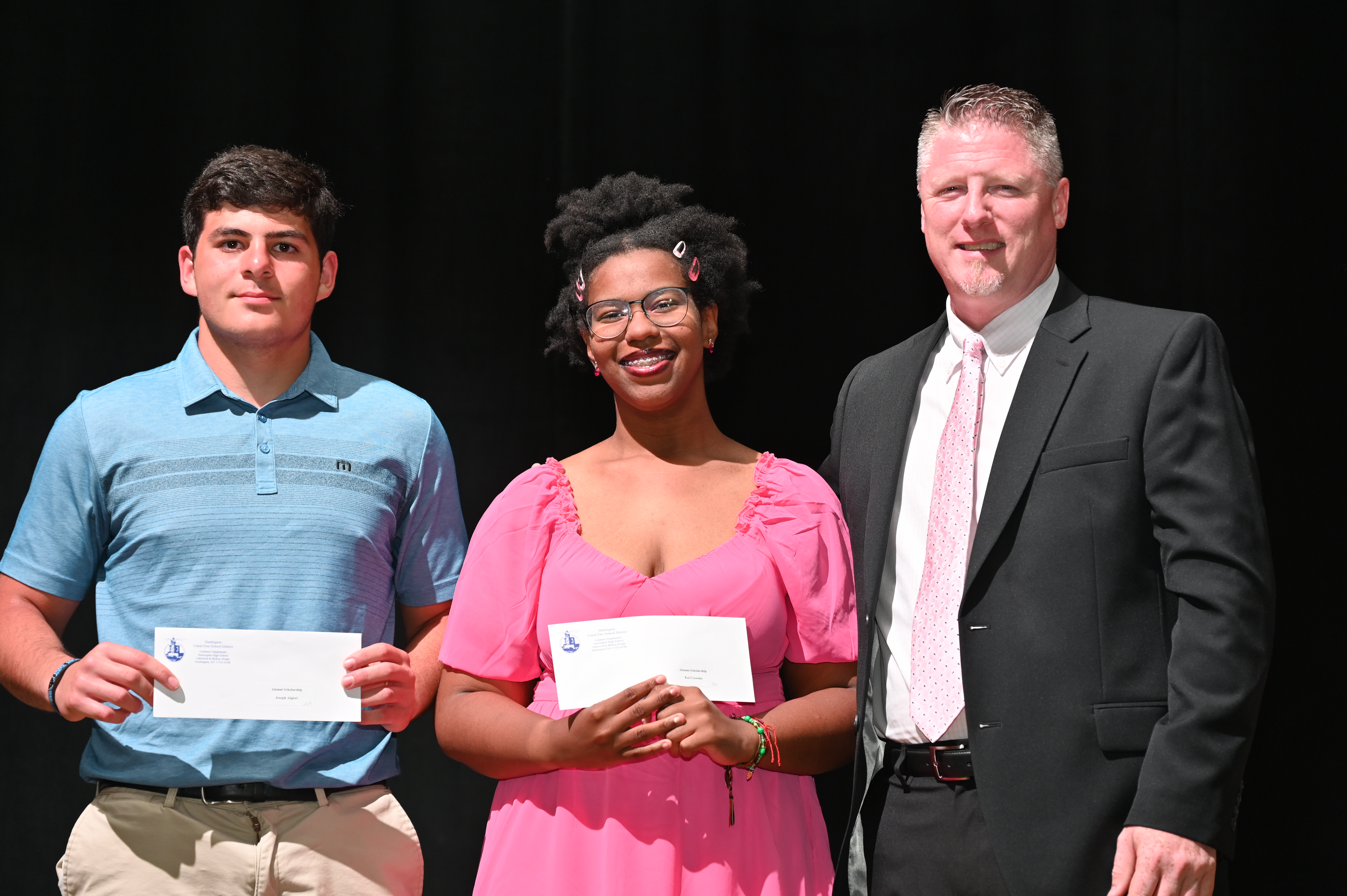  Principal Brenden Cusack with alumni scholarship recipients Joseph Algieri and Koi Crowder   
