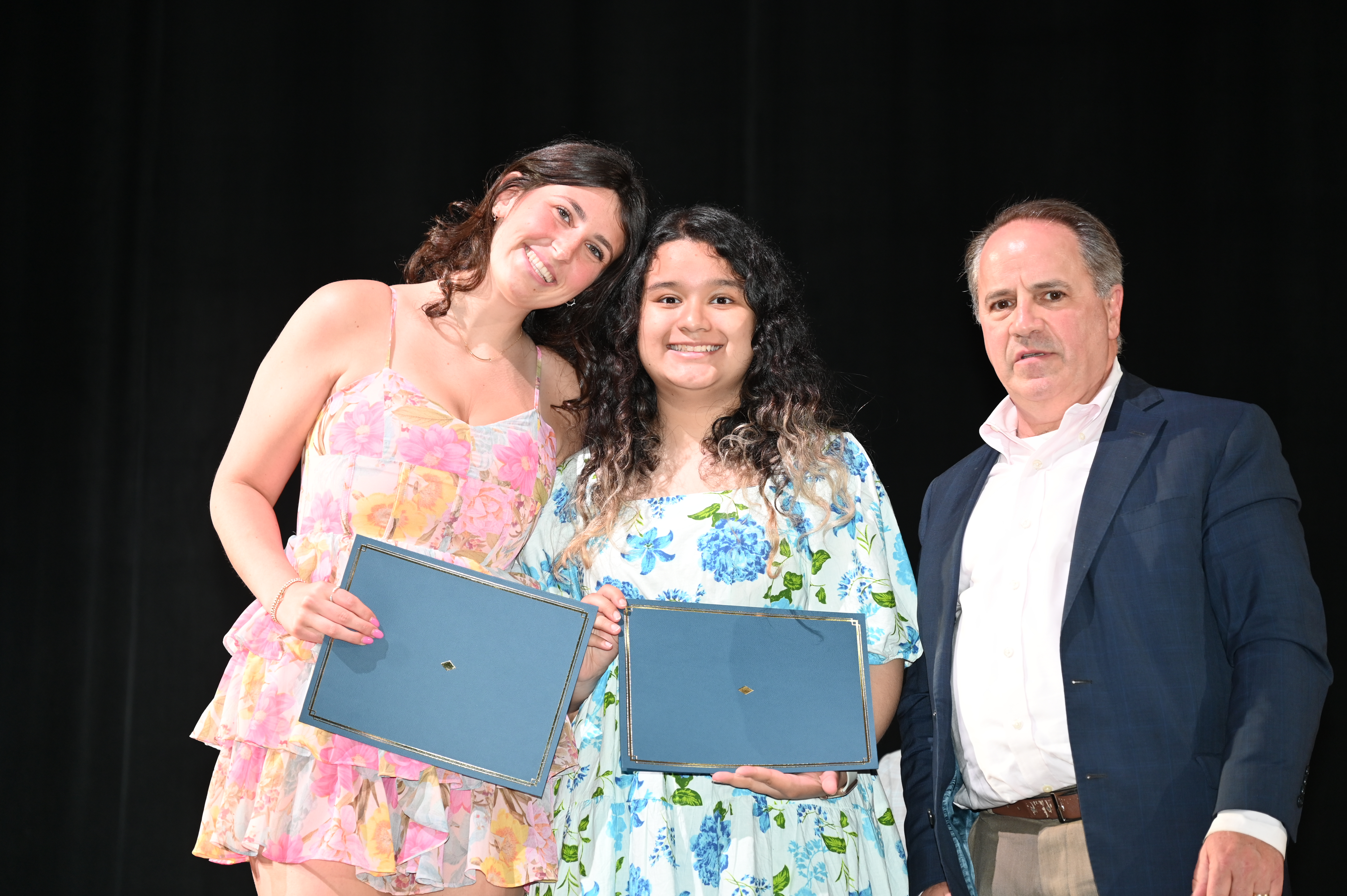  Ella Kamenstein and Angie Hernandez-Ramos with Humanities Chairman Joe Leavy.  