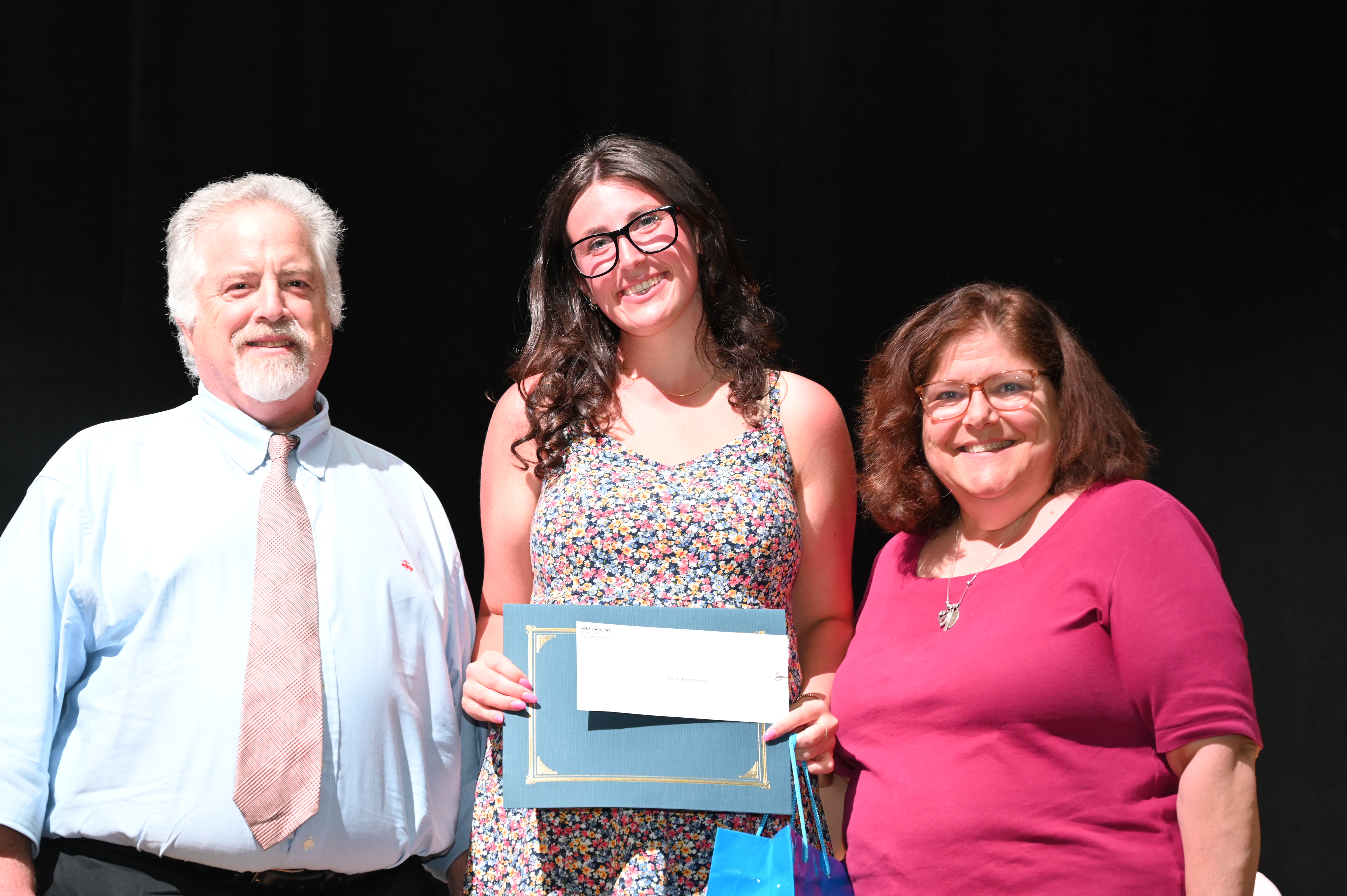  Ella Kamenstein is flanked by Glen and Anne Manaker   