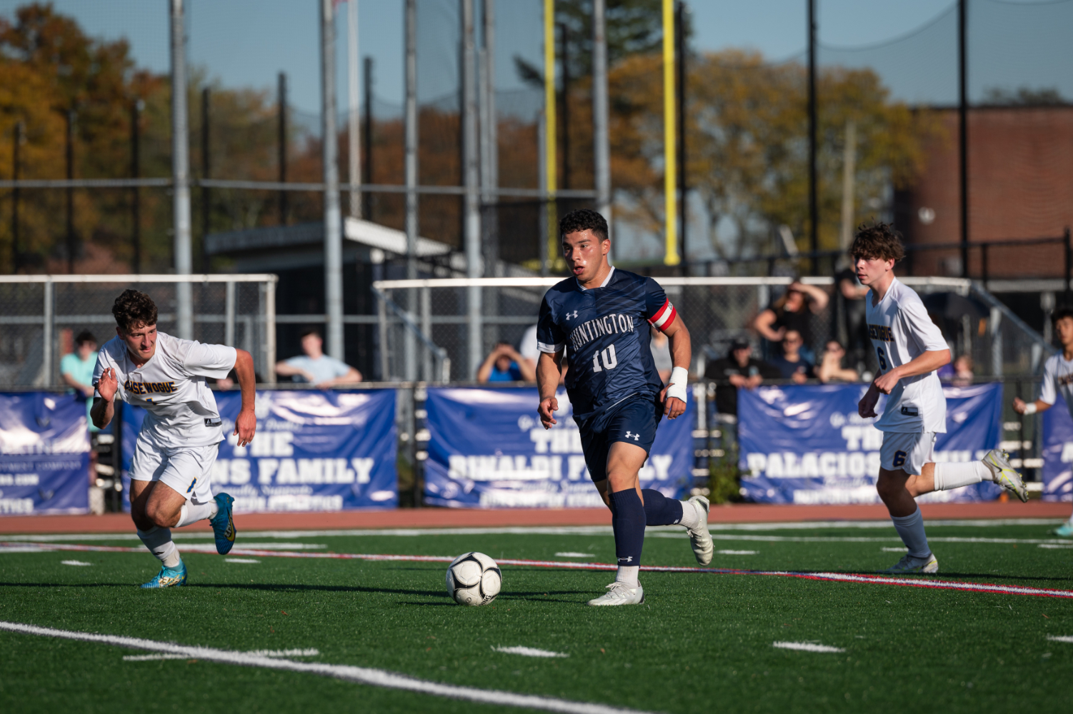  Bryan Lizama weaves through the defense for Huntington. (Darin Reed photo.)  