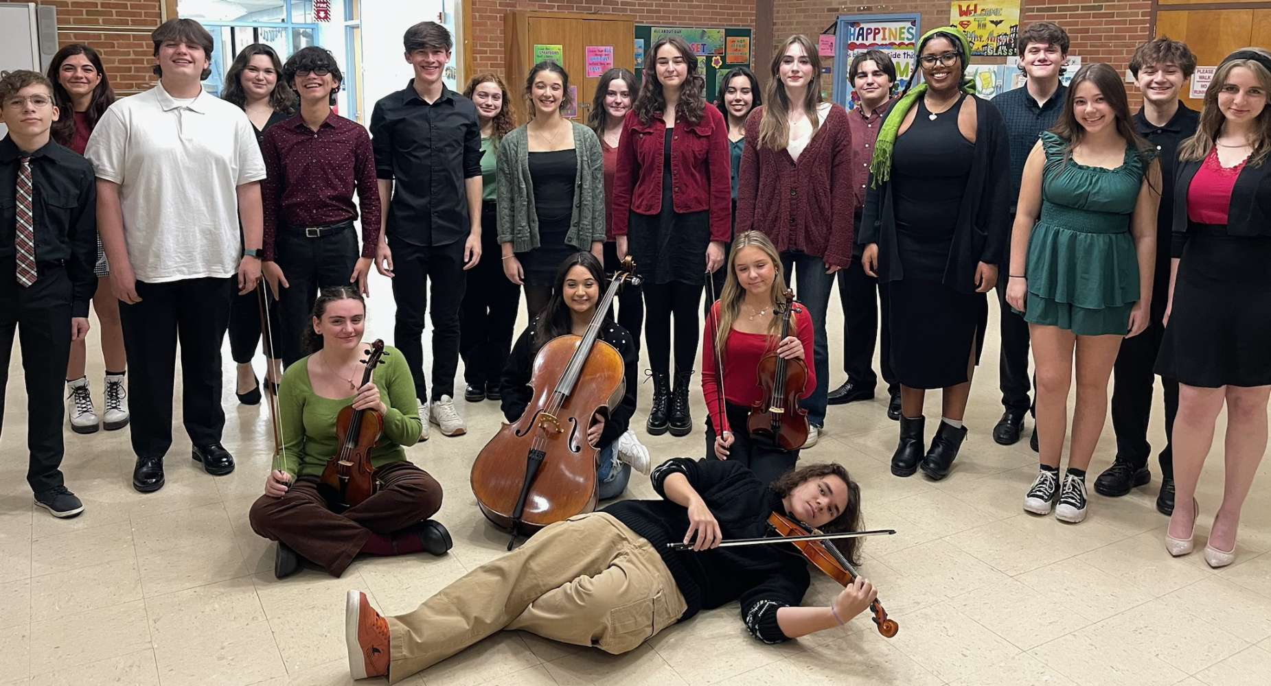  The Huntington chamber choir and a string quartet played holiday favorites at the Huntington School Board meeting on Monday.   