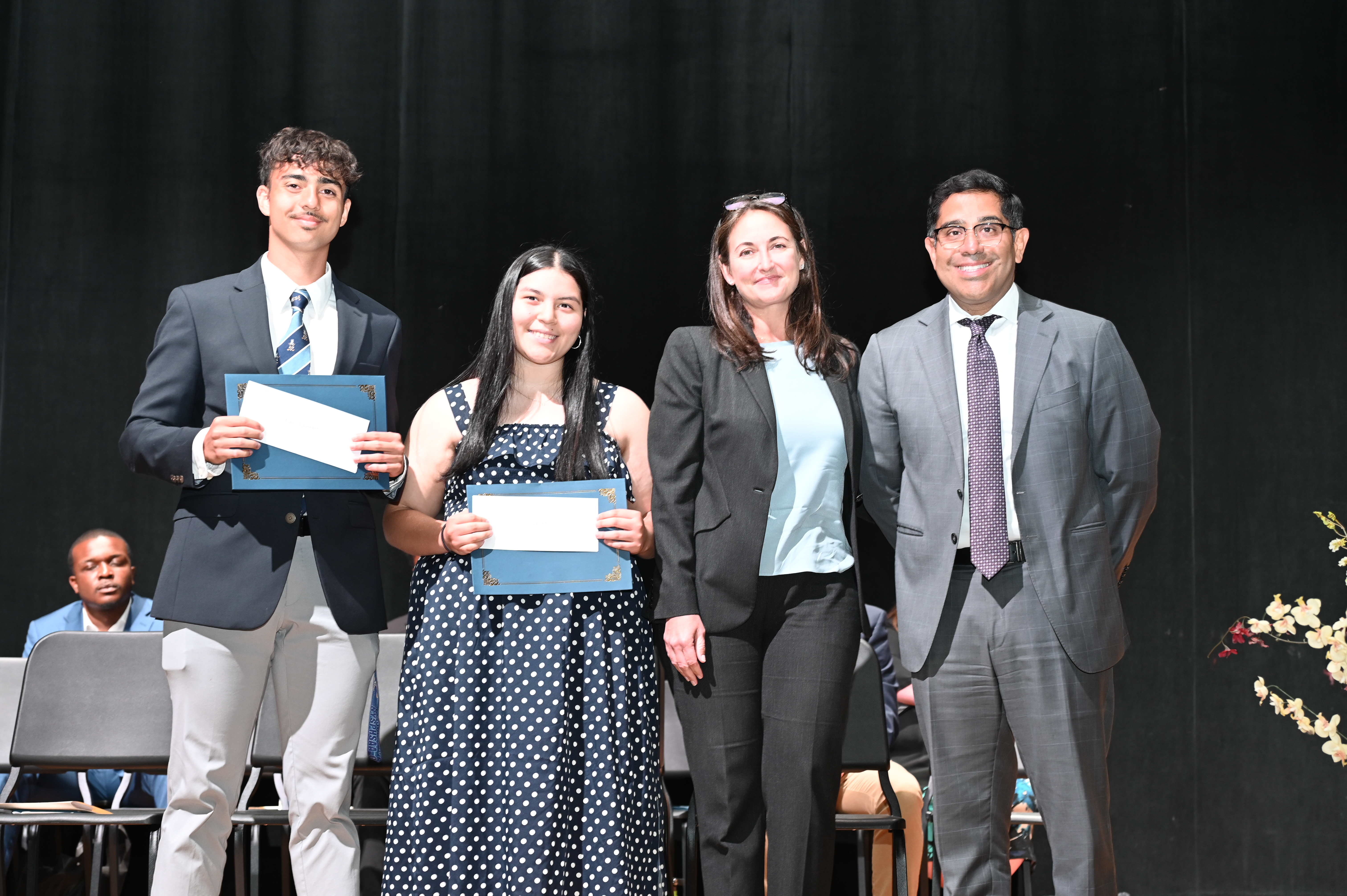  Laura and Xavier Palacios with scholarship recipients Evan Spagnoletti and Evelyn Benitez   