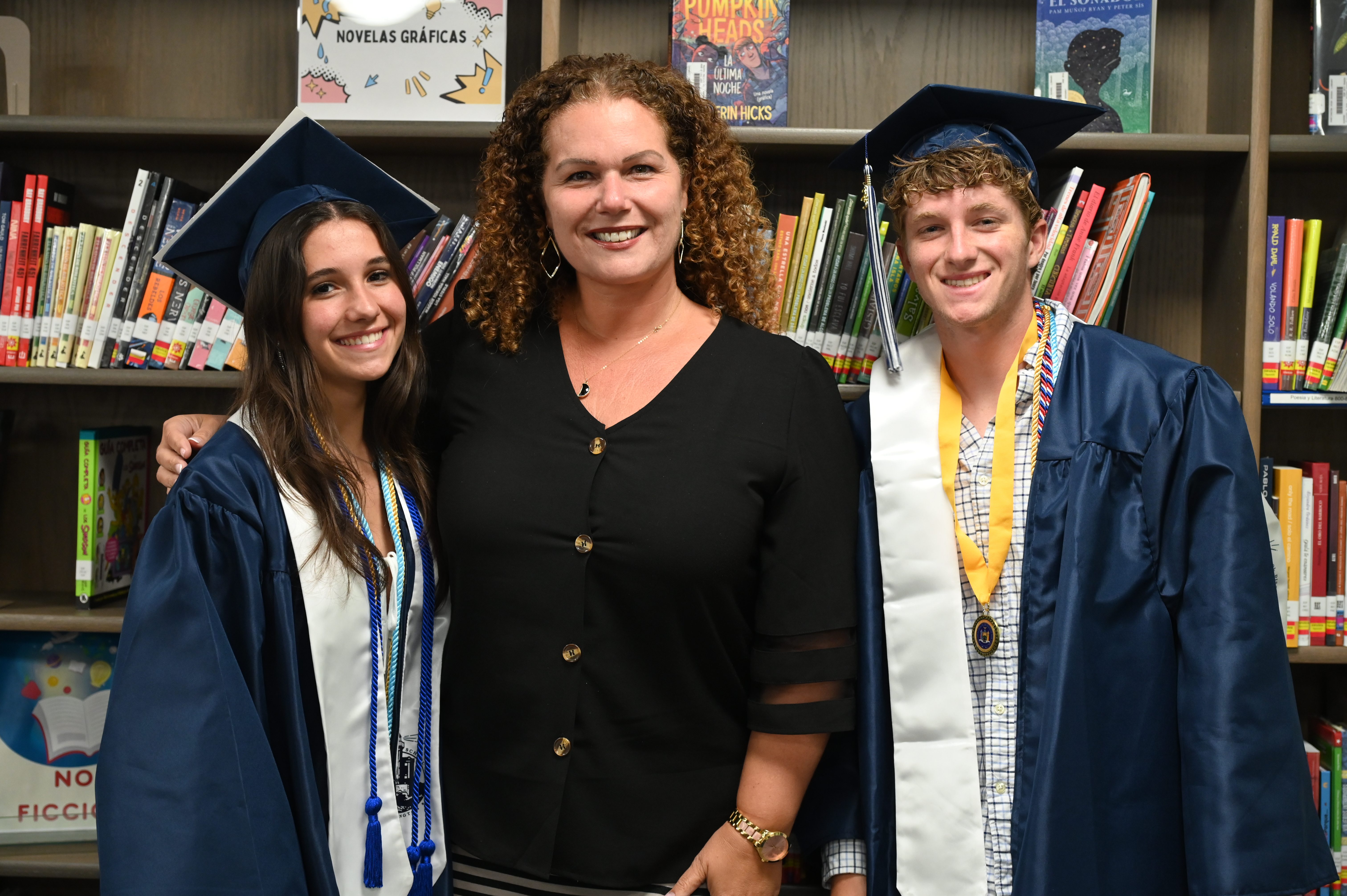  Kleet Lumber Scholar Athlete Award recipients Tessie Maerz and Kieran Husselbeck with Assistant Superintendent Beth McCoy   