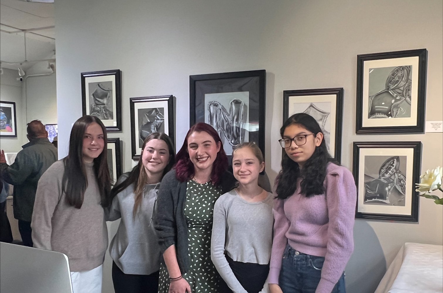  Finley art students and teacher Jessica Simms at the opening reception at The Atelier at Flowerfield.  