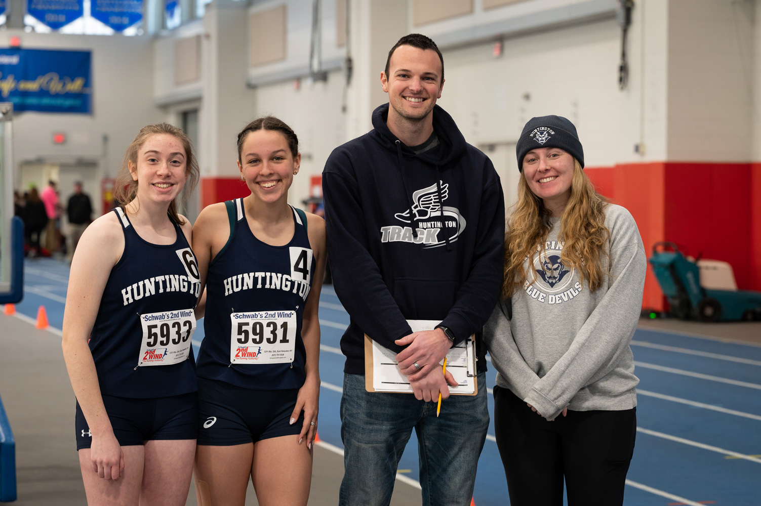 Captains Megan Donaghy and Sophie Bradford with coaches John Kaplan and Sarah Hall. (Darin Reed photo.)