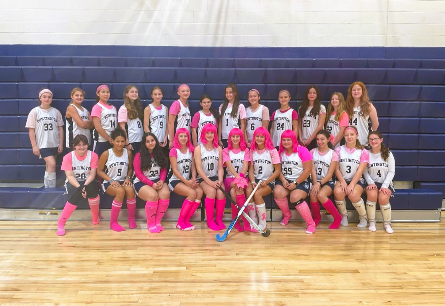  The 2023 Finley Middle School field hockey team dressed in pink for charity.   