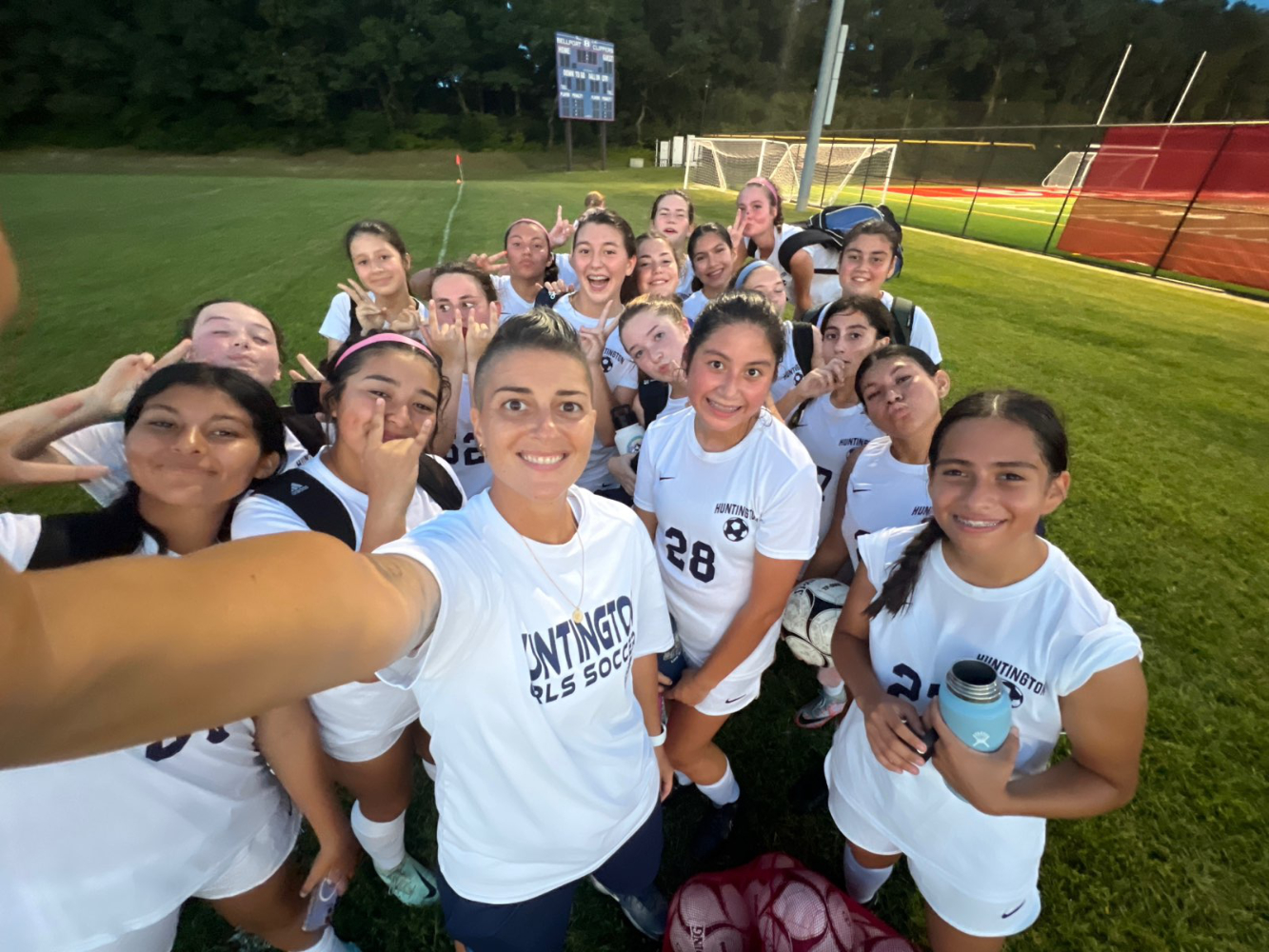  Huntington JV girls' soccer coach Maria Canino and her players.  