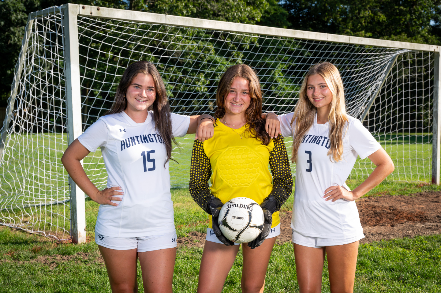  Reese Rinaldi is flanked by teammates Riley Murtagh and Emersen Evans. (Darin Reed photo.)  
