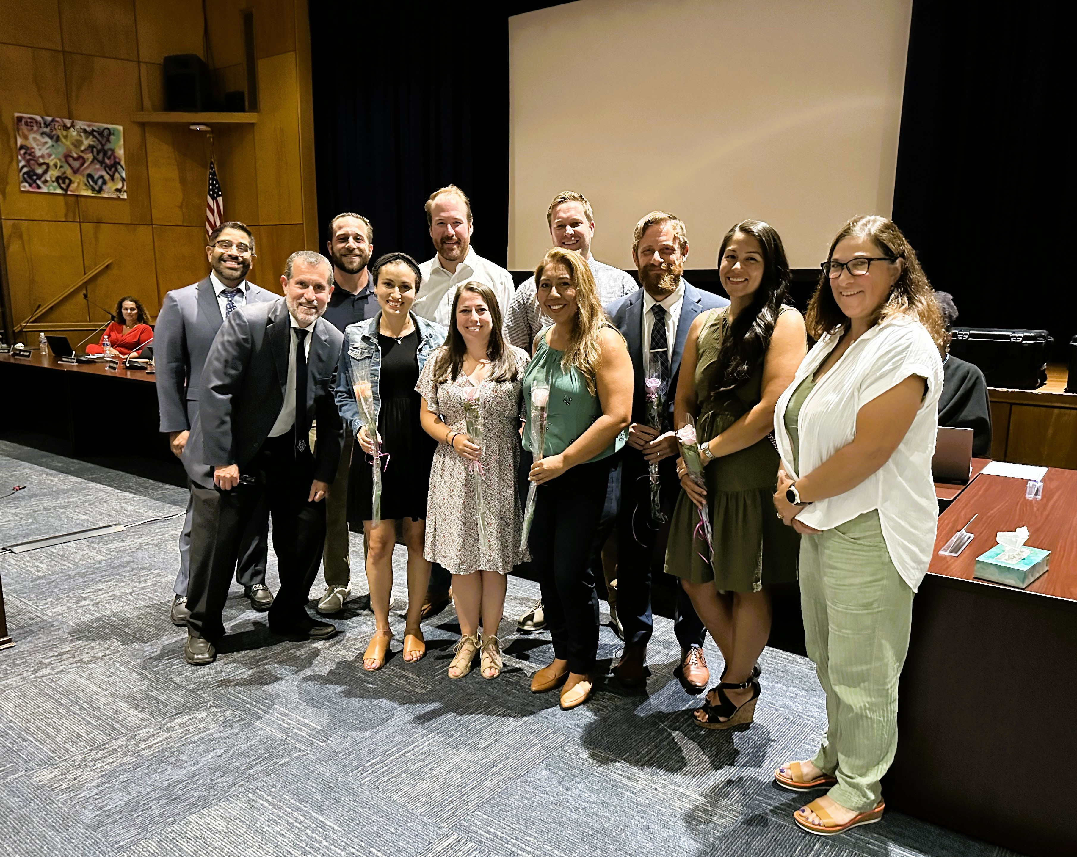  The newly tenured teachers with Supt. Jim Polansky and School Board President and Vice President Xavier Palacios and Michele Kustera  
