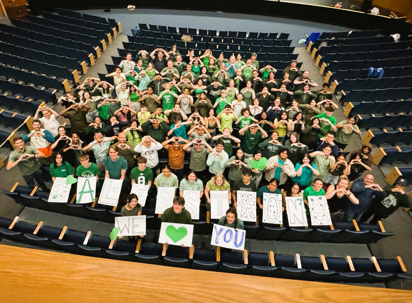  Decked out in green, the Blue Devil band family expressed its love for its Farmingdale counterparts.    