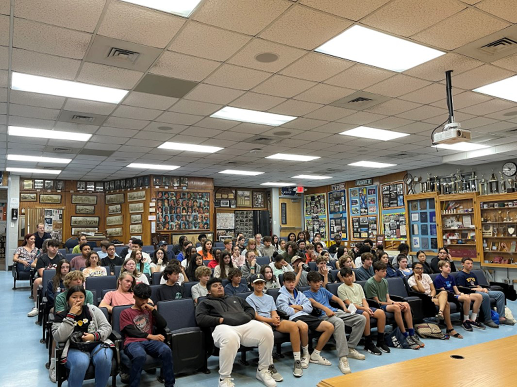 Incoming freshmen crowded into the School Heritage Museum room.