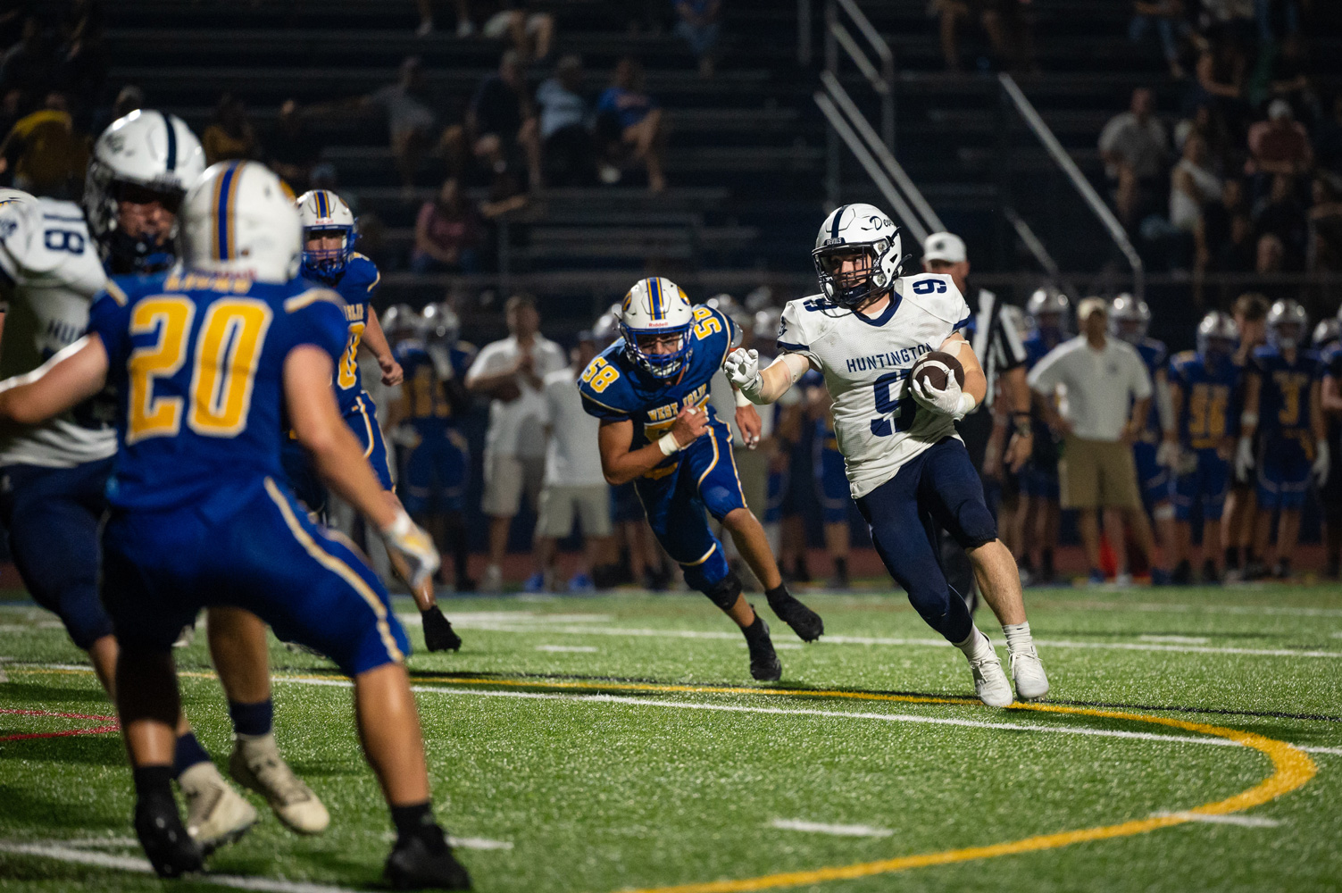 Junior Timmy McDonald has the ball and gathers steam. (Darin Reed photo.)