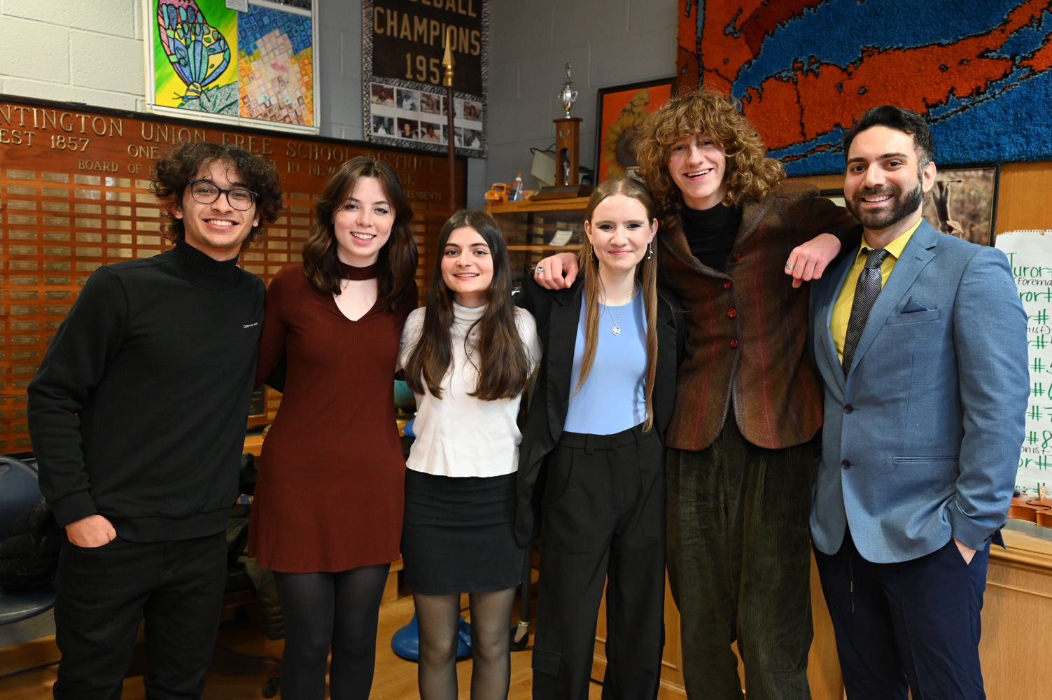  Tri-M Music Honor Society executive board members and advisor James DiMeglio.  