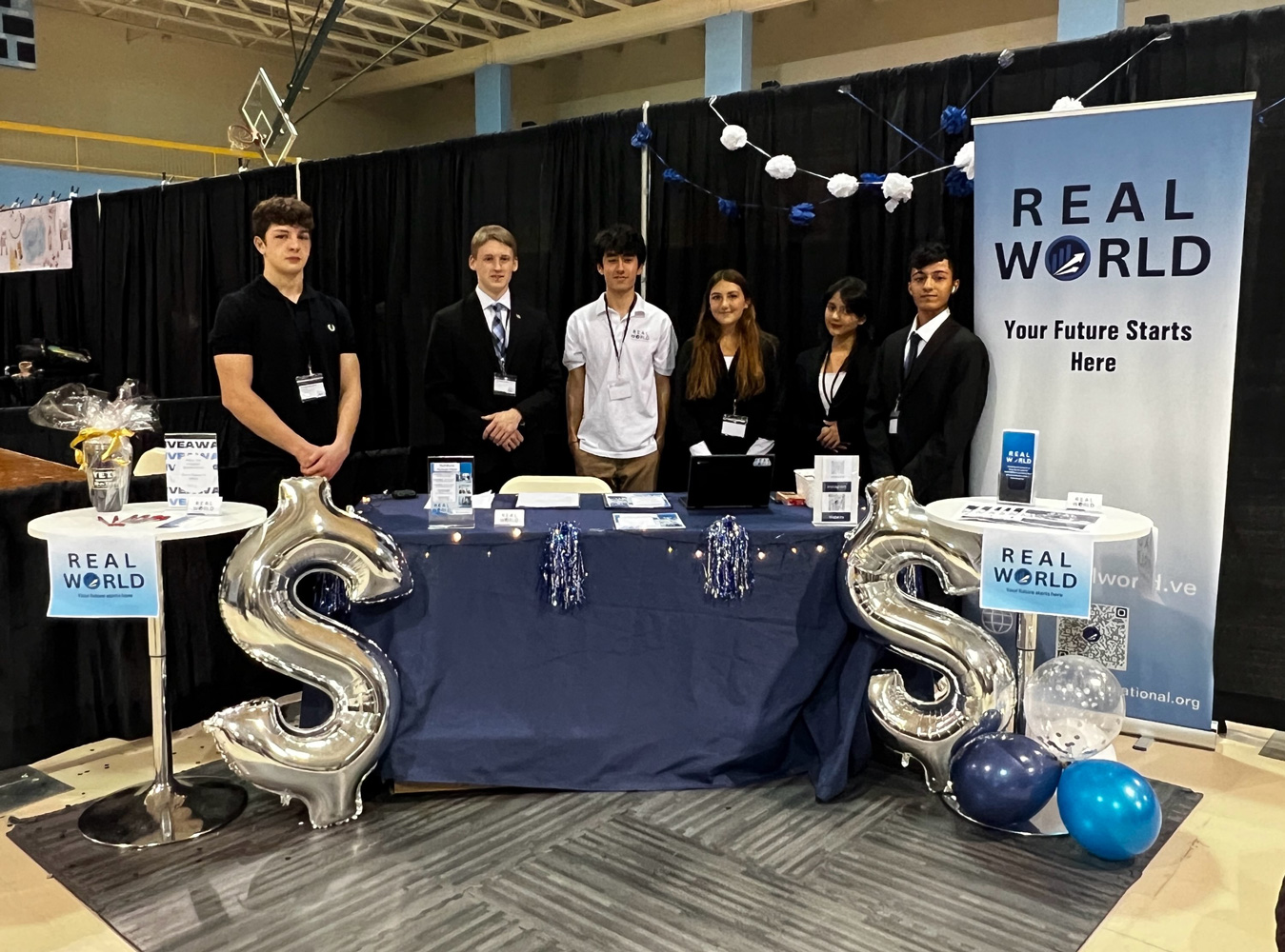  Real World company officials at their trade show booth.  