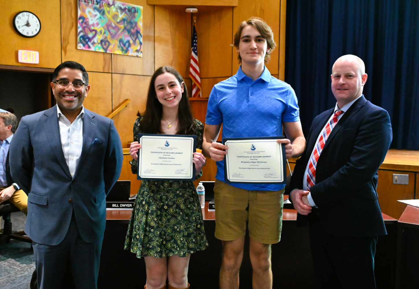  School Board President Xavier Palacios and Supt. Christian Bowen flank valedictorian Charlotte Gordon and salutatorian Benjamin Edgar  