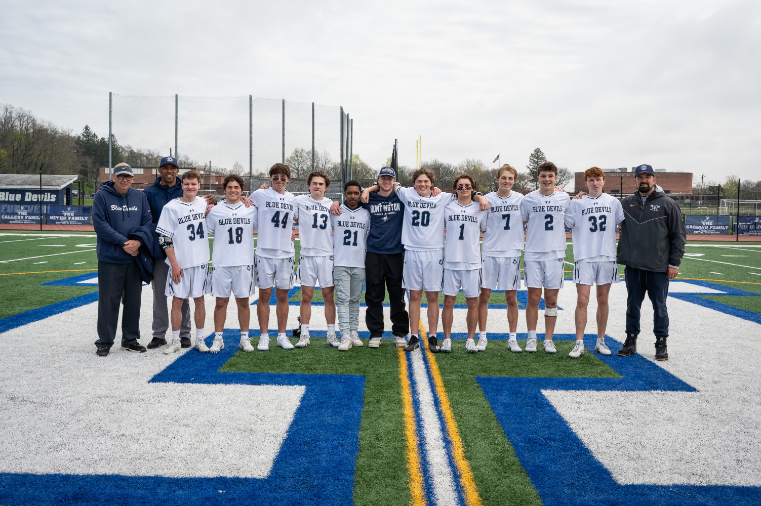  The Huntington boys' lacrosse seniors and their coaches. (Darin Reed photo)  