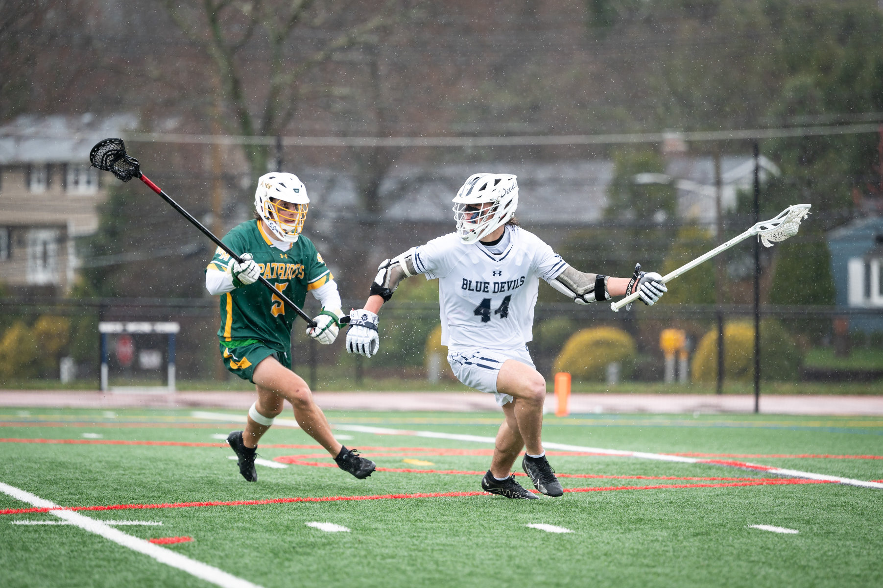Dan McNulty with the ball and Ward Melville in pursuit. (Darin Reed photo.)