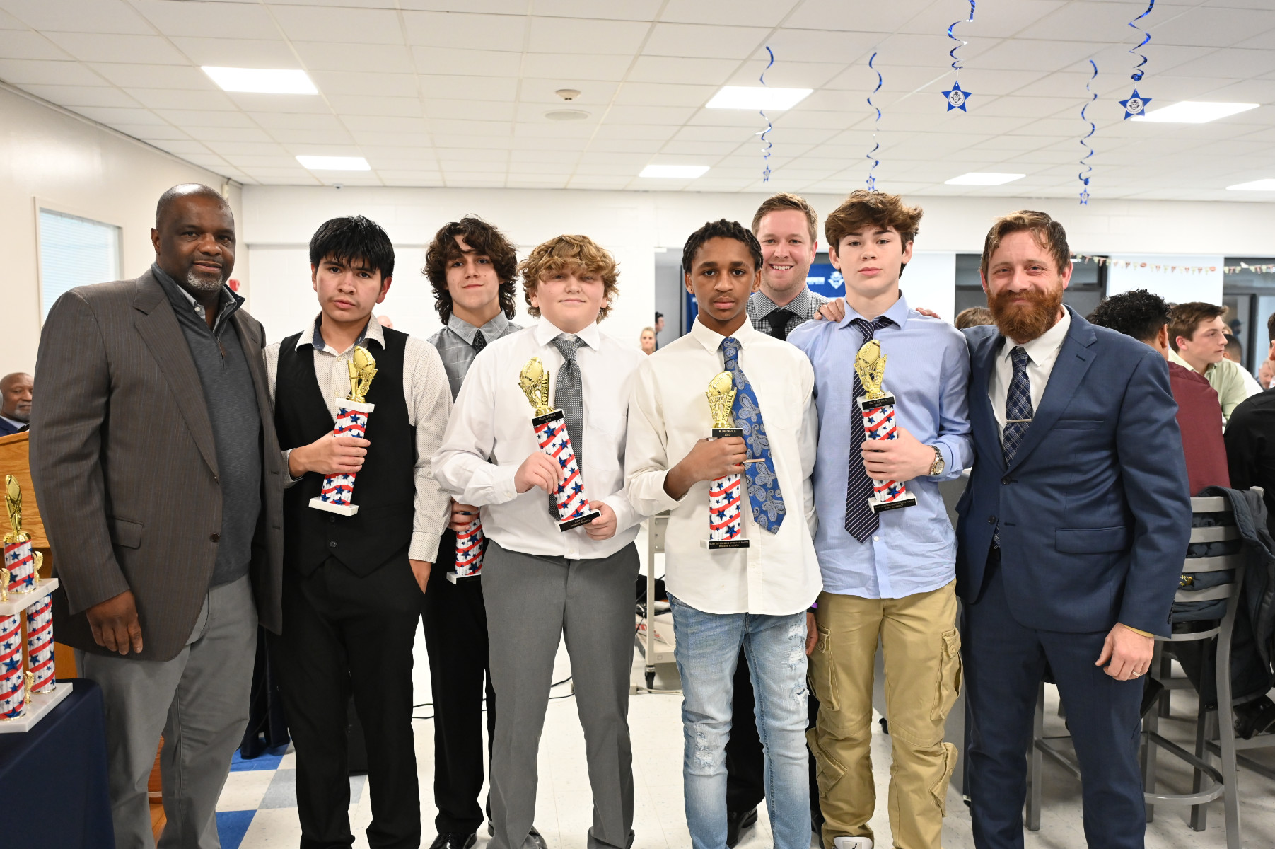  Finley's top football players with coaching staff members.   