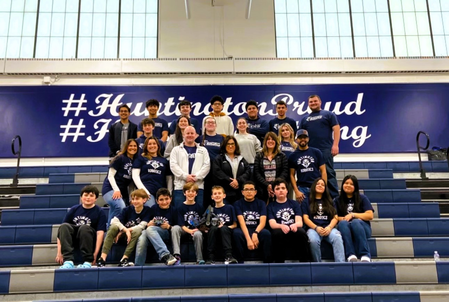  Huntington Robotics team members with school officials, parents and advisor Omar Santiago.  
