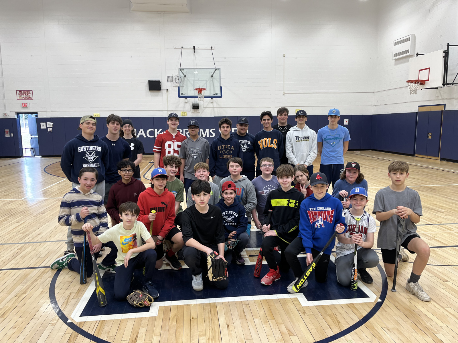  A group of baseball clinic participants with Blue Devil varsity players.  