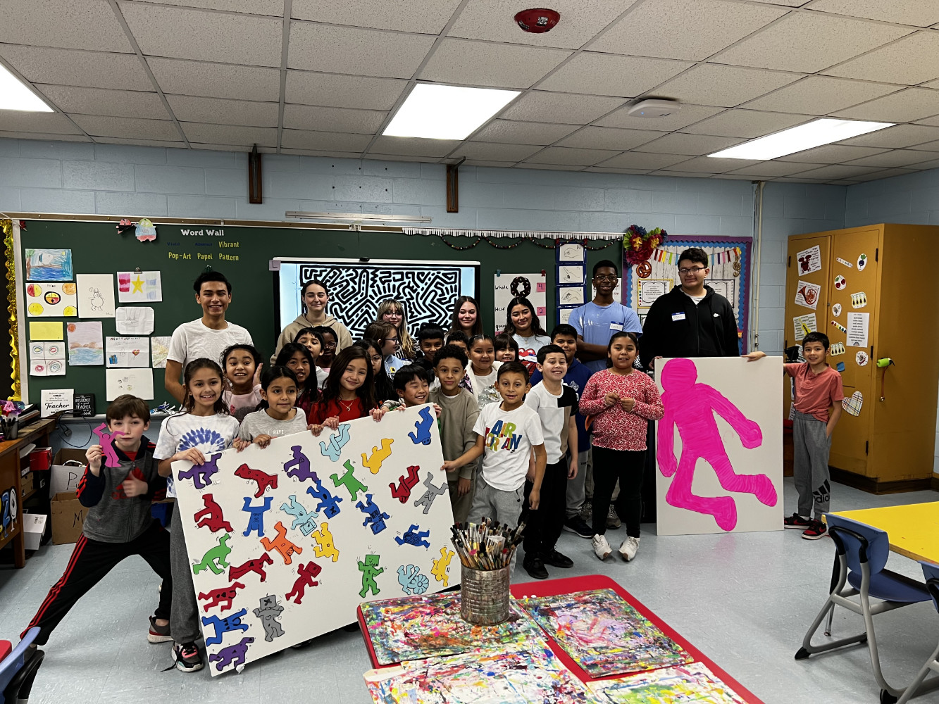  Each of the third grade classes showed off their artwork with their assistants   