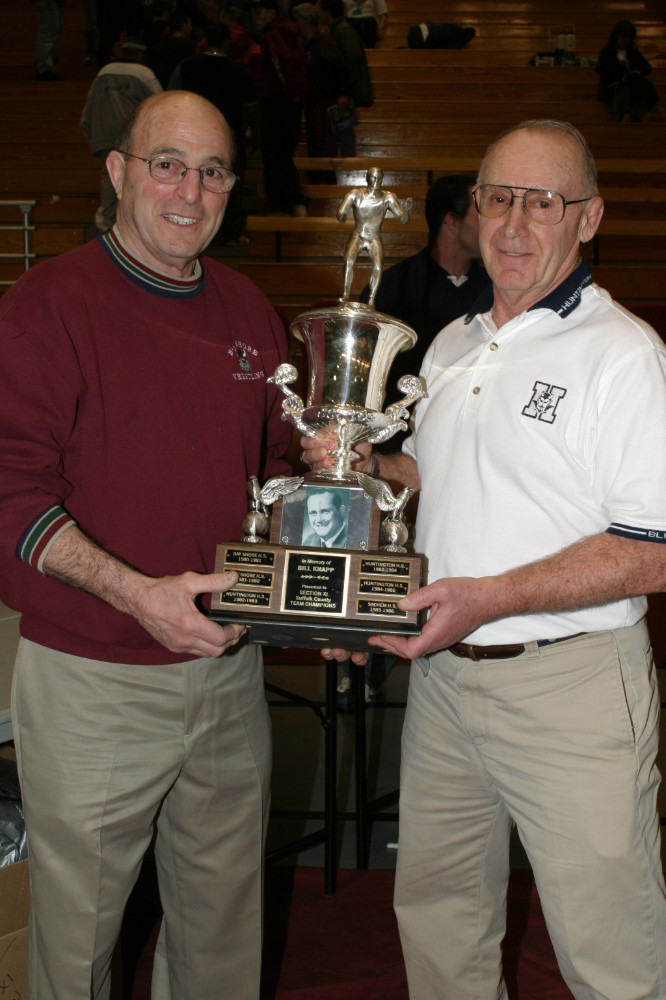  Jumper Leggio presenting the Bill Knapp County Championship Trophy to Huntington coach Lou Ginai.  