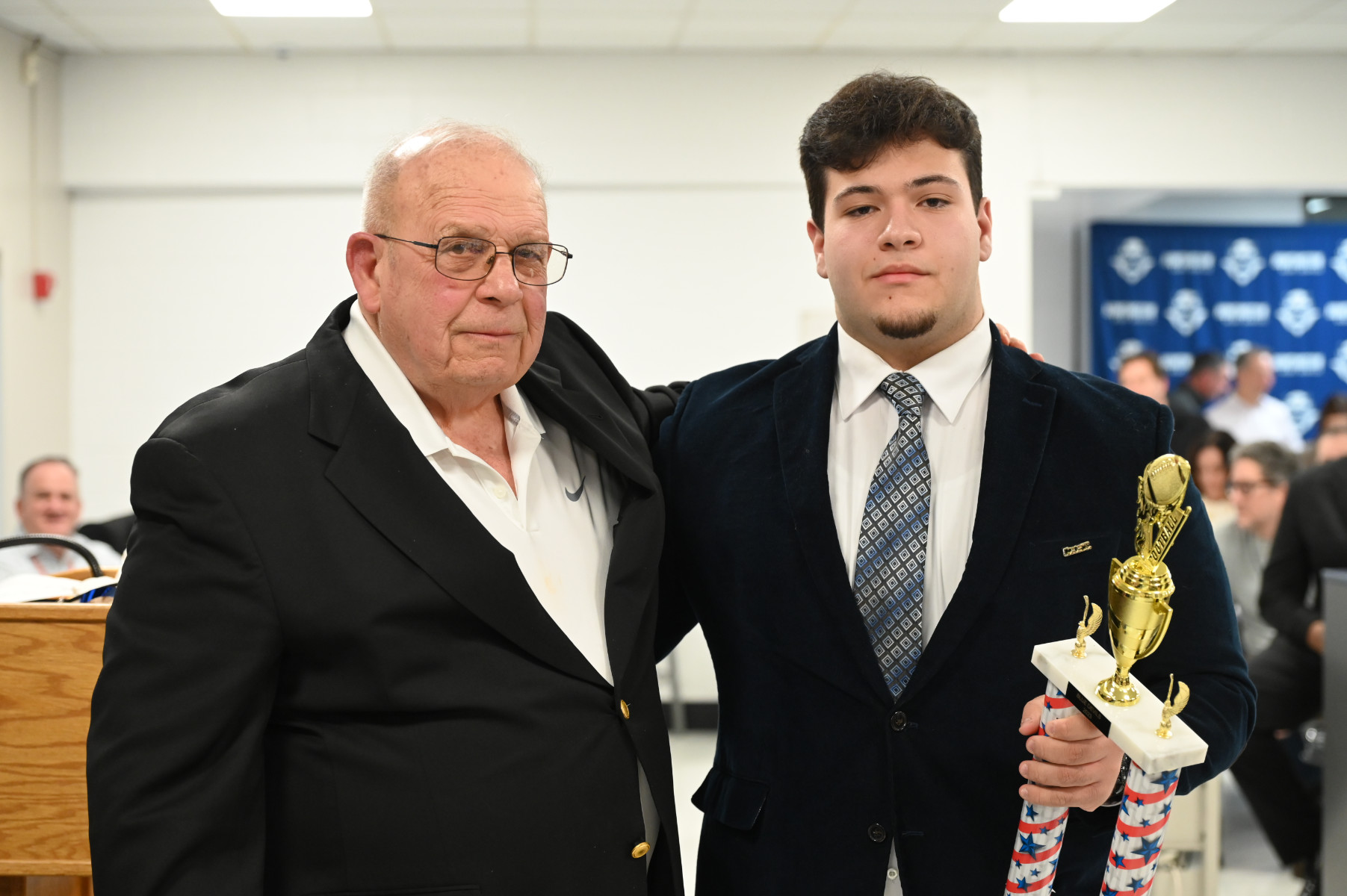  Huntington Class of 1956 member Pete Sansiviero with senior lineman Carmine Carusone   