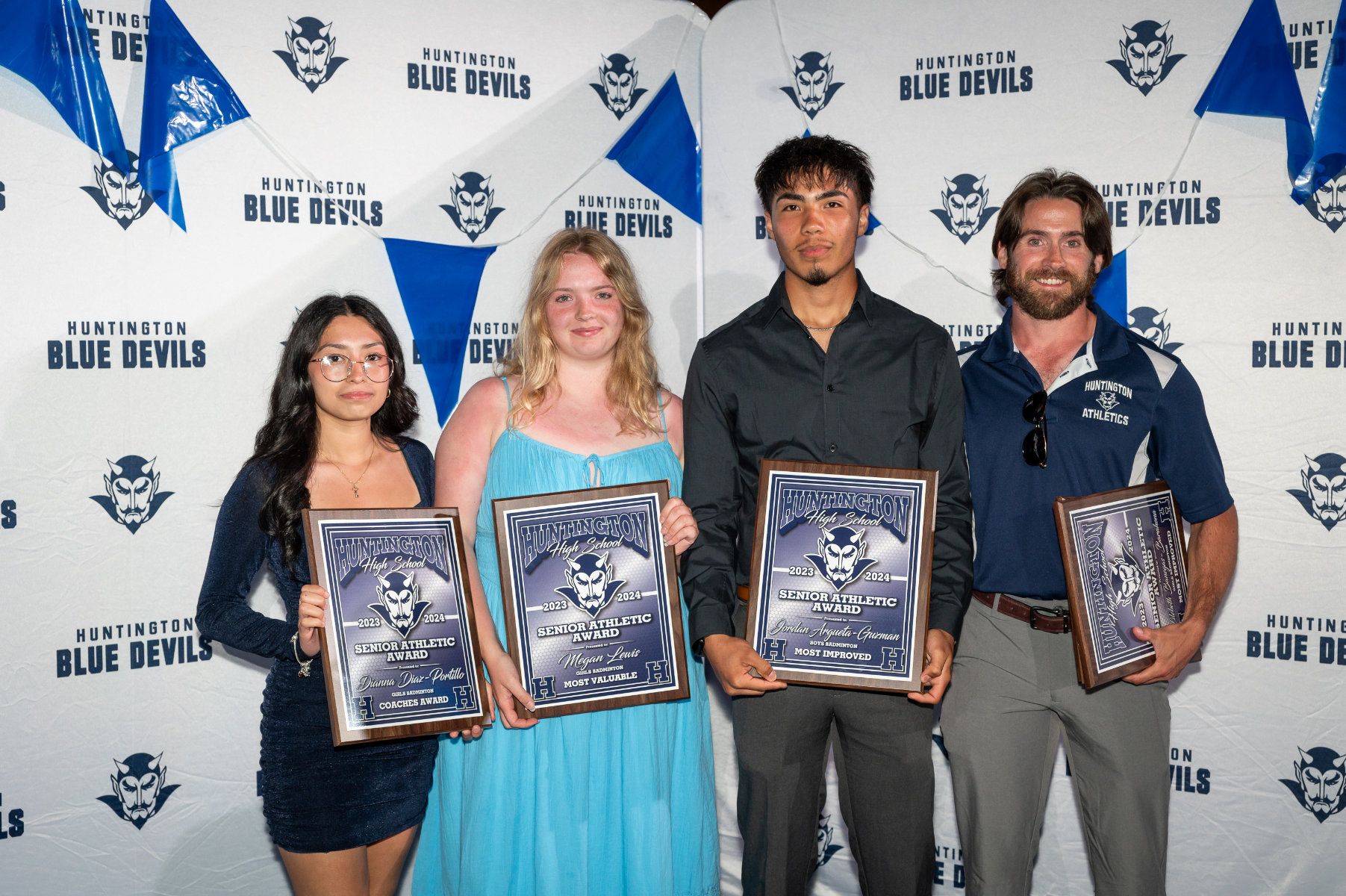 H-ton badminton coach Alex Nelson with Dianna Diaz-Portillo, Megan Lewis and Jordan Argueta-Guzman. (Darin Reed photo.)