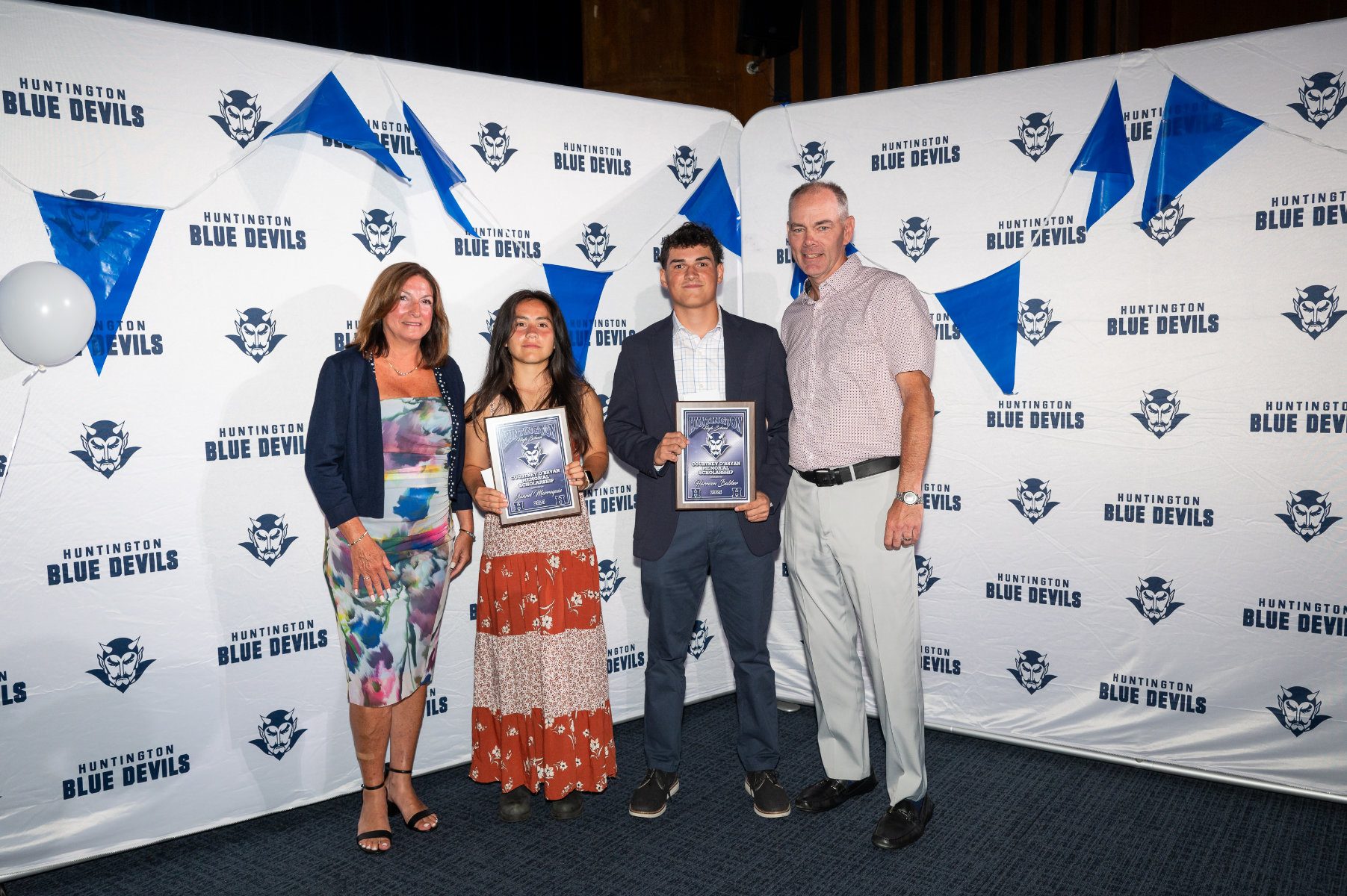  Courtney O'Bryan Memorial Scholarship recipients Jannel Marroquin and Harry Baliber with Ms. O'Bryan's parents, Lisa and Bill.  
