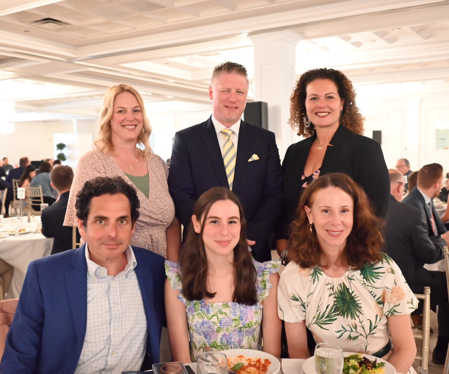  Charlotte Gordon surrounded by her parents and school officials at the valedictorian's luncheon.  