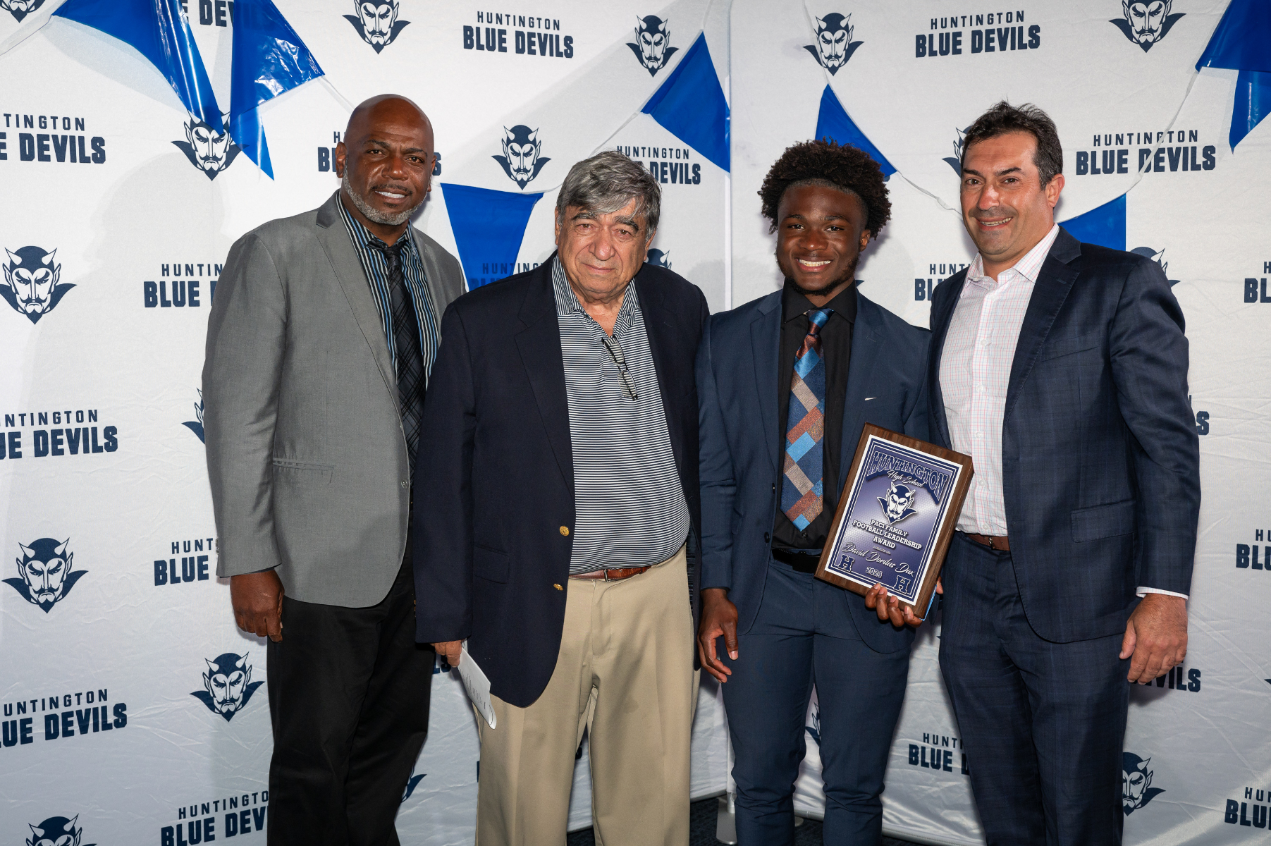  Paci Family Football Award recipient David Dax with Ron Wilson, John Paci, Jr. and Dr. James Paci. (Darin Reed photo.)  