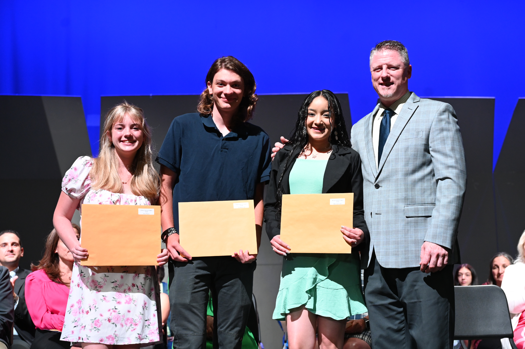  Huntington seniors Olivia Polinsky, Jack Ruthkowski and Helen Ayala Castro with Principal Brenden Cusack.    