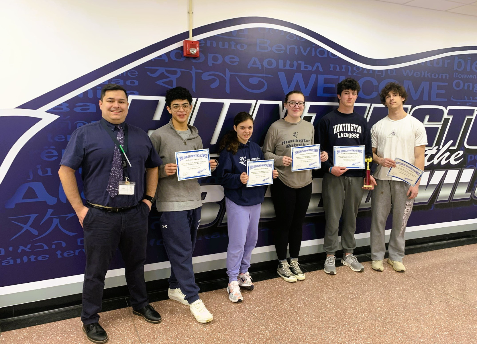  Huntington teacher Joseph Monroy with members of the high school's Physics Olympics team.  