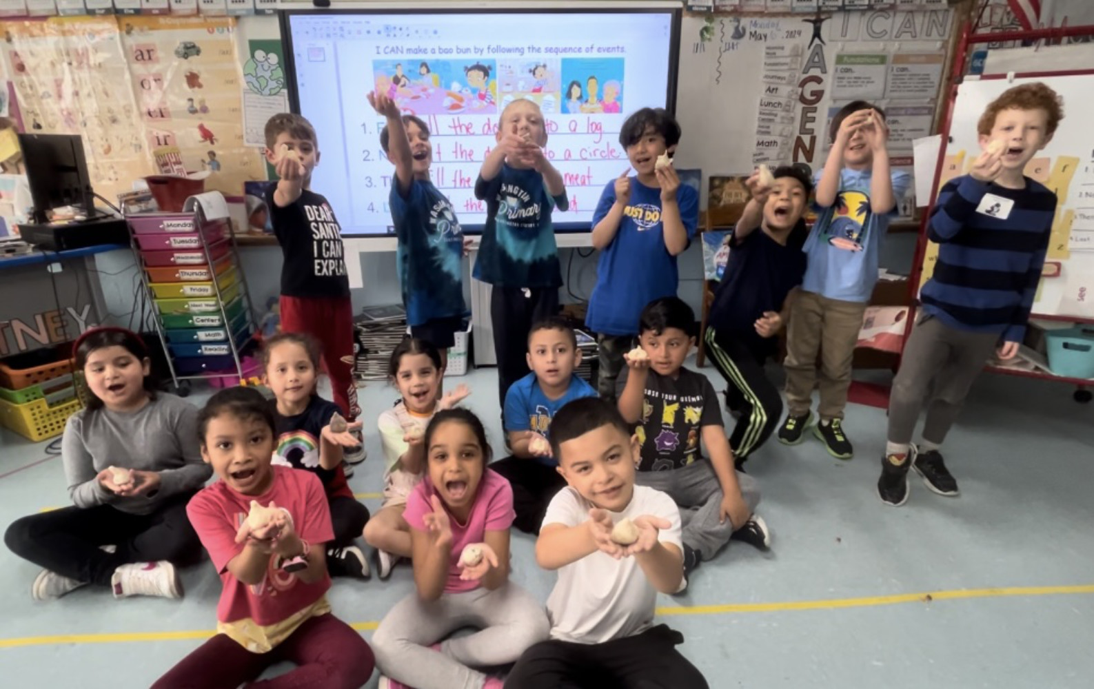  Washington first graders show off their bao buns.  