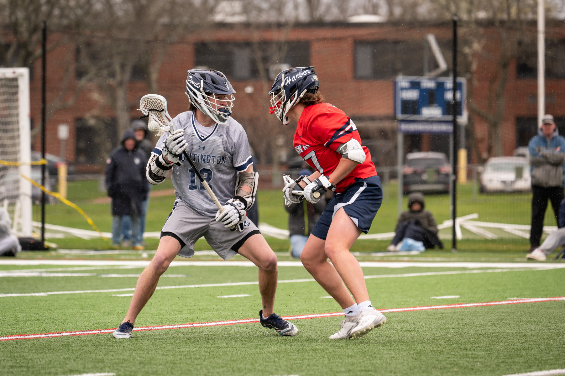  Junior midfield Colin Lennon (left) goes one on one for Huntington. (Darin Reed photo.)  