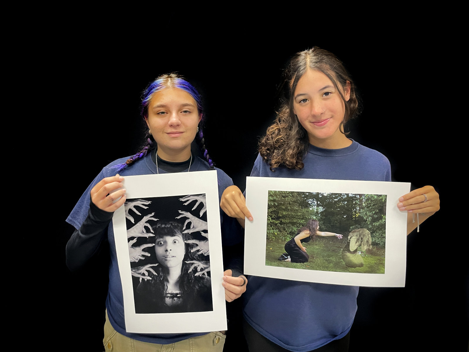  Huntington's Taylor Nappi and Madeline Francis hold their framed artwork.